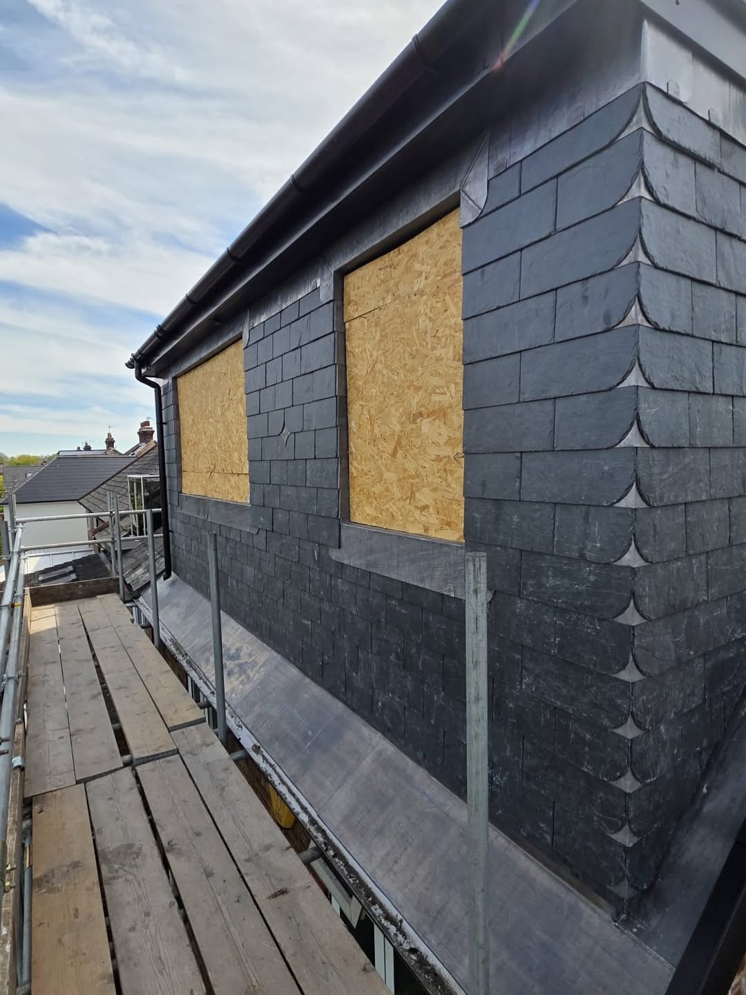 Slate-clad dormer cheek with bullnose detail