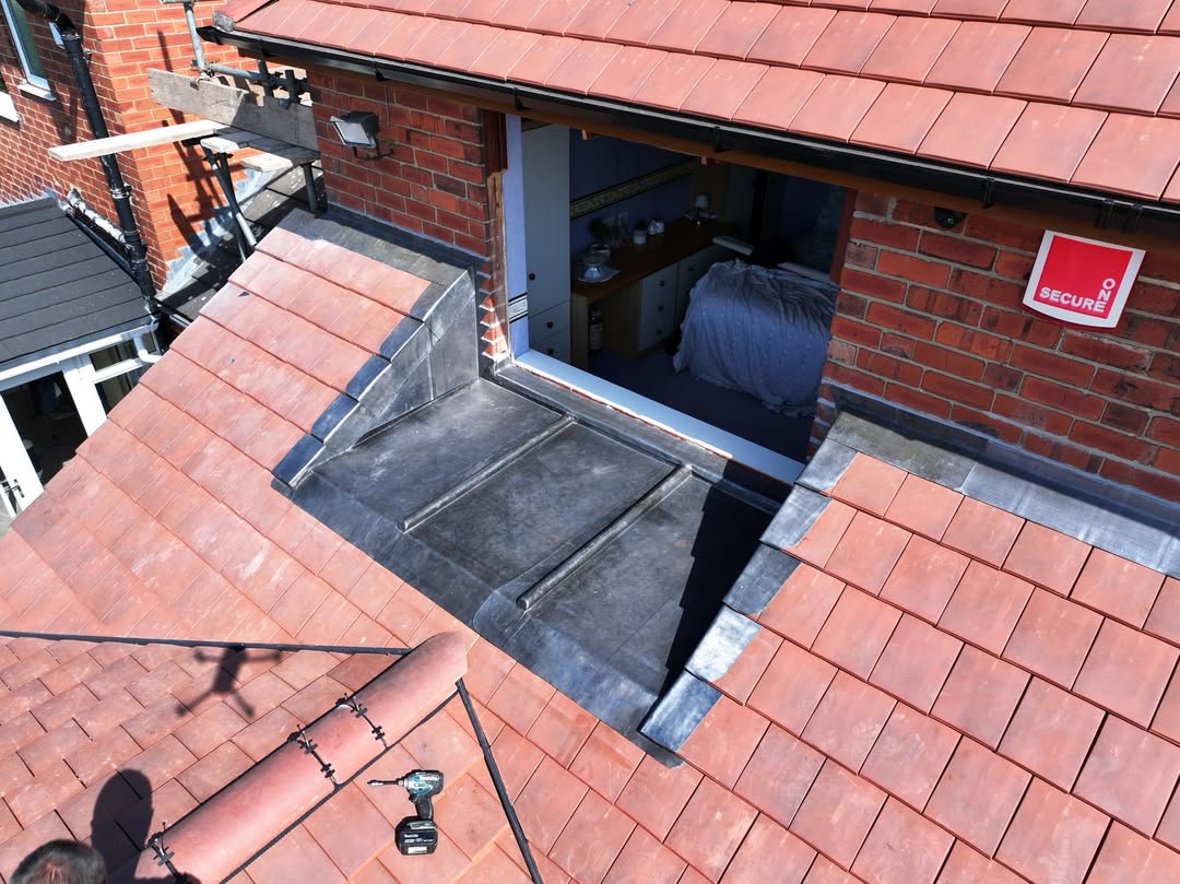 Bespoke lead-lined box gully on tiled roof